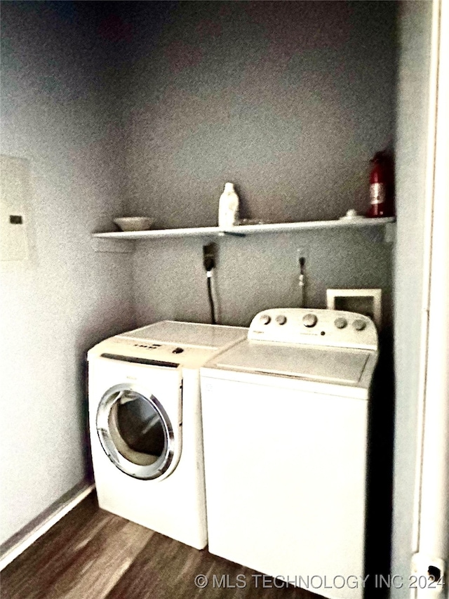 washroom with independent washer and dryer and hardwood / wood-style floors