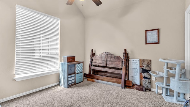 bedroom featuring lofted ceiling, light colored carpet, and ceiling fan