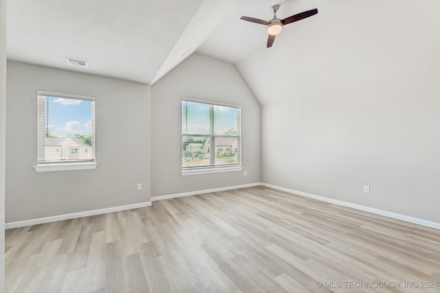 3408 Redbud Ln, Tulsa, OK 74132 - empty room with vaulted ceiling, light wood-style flooring, a ceiling fan, and baseboards
