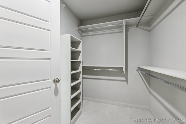 walk in closet featuring light tile patterned floors