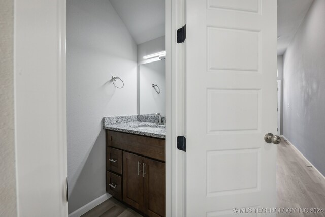 bathroom featuring hardwood / wood-style floors and vanity