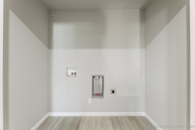 3408 Redbud Ln, Tulsa, OK 74132 - washroom featuring electric dryer hookup, hookup for a washing machine, light wood-style flooring, and baseboards