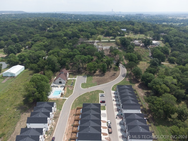 3408 Redbud Ln, Tulsa, OK 74132 - aerial view of property's location with a forest, nearby suburban area, and a pool area