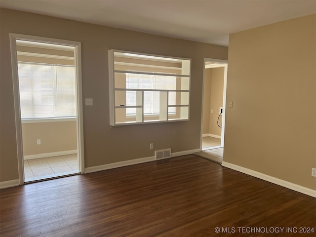 unfurnished room featuring hardwood / wood-style floors