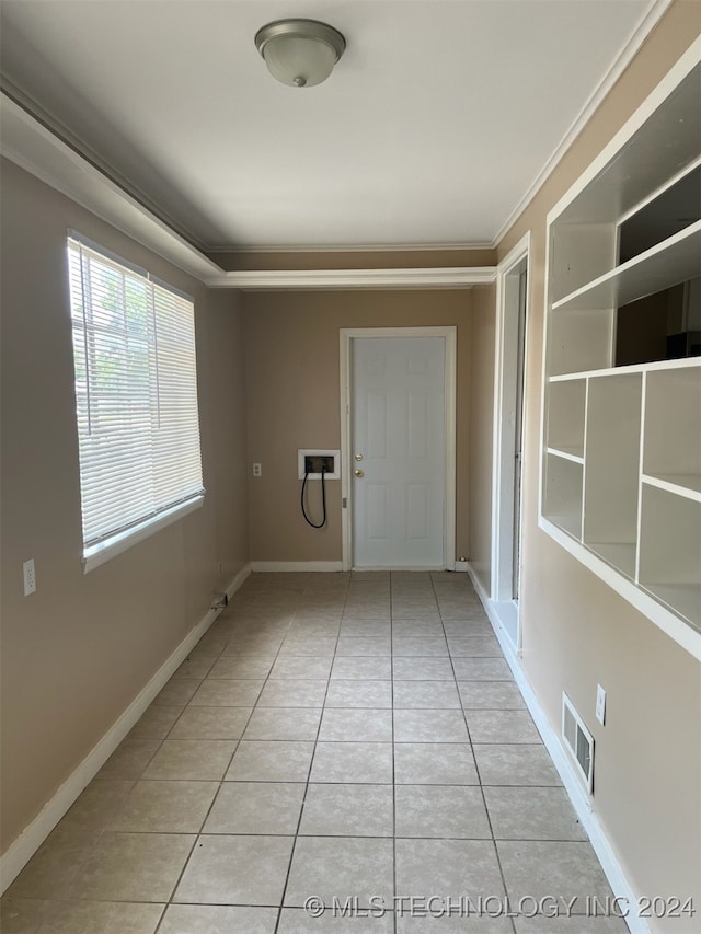 tiled empty room with ornamental molding