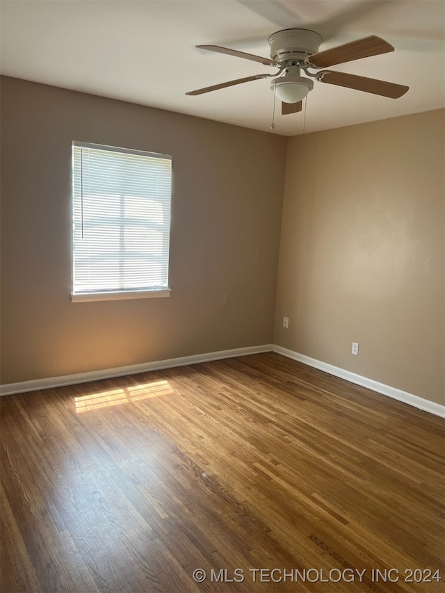 unfurnished room with ceiling fan and hardwood / wood-style floors