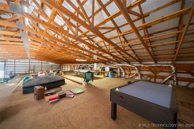 game room with vaulted ceiling