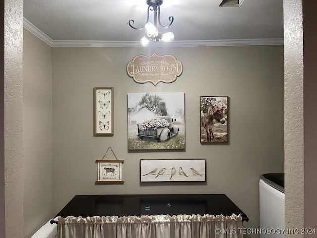 interior space with crown molding and a notable chandelier