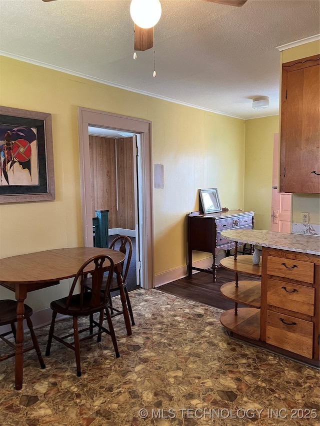 office space featuring ceiling fan, crown molding, and a textured ceiling