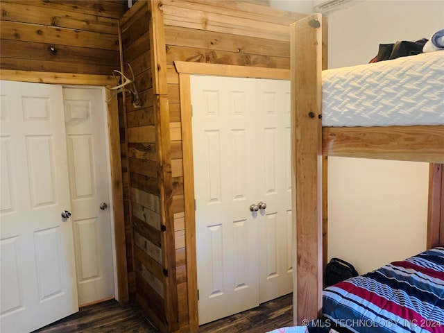 bedroom with dark wood-type flooring