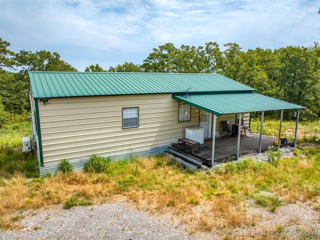 view of side of property with a deck