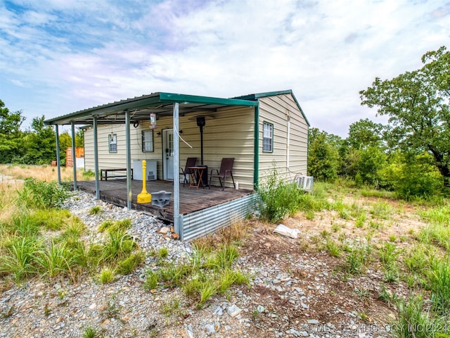 view of side of property featuring a deck