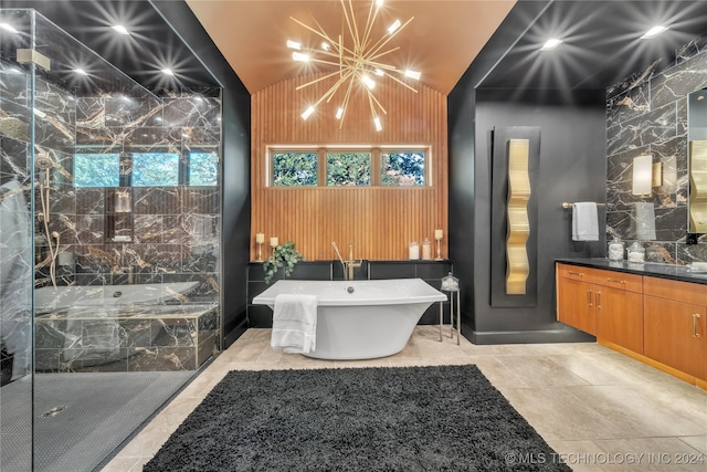 full bathroom with lofted ceiling, a soaking tub, vanity, a chandelier, and walk in shower