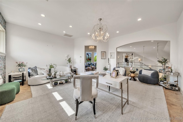 living area with arched walkways, recessed lighting, and an inviting chandelier