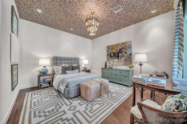 bedroom featuring a chandelier, wood finished floors, visible vents, baseboards, and an ornate ceiling