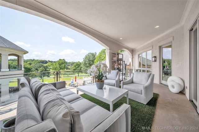 view of patio with an outdoor living space and a balcony