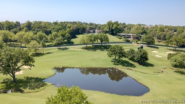 surrounding community featuring a water view and view of golf course