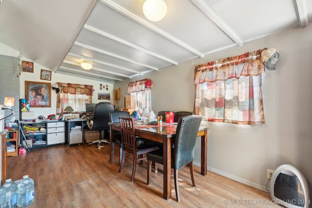 dining room with lofted ceiling and hardwood / wood-style flooring