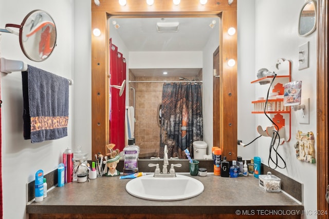 bathroom featuring toilet and vanity