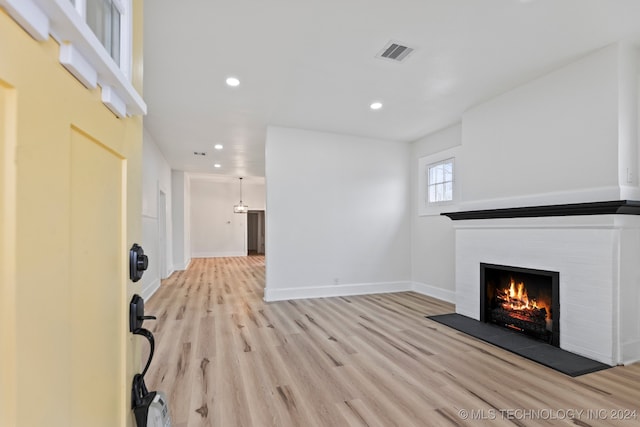 unfurnished living room with light wood-type flooring