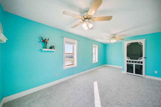 interior space with ceiling fan and carpet floors