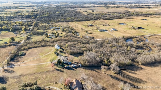 birds eye view of property featuring a rural view