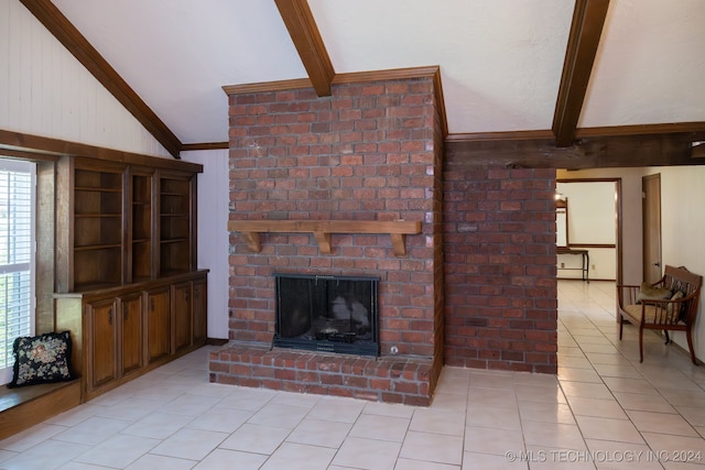 living room featuring lofted ceiling with beams, light tile patterned floors, and a brick fireplace