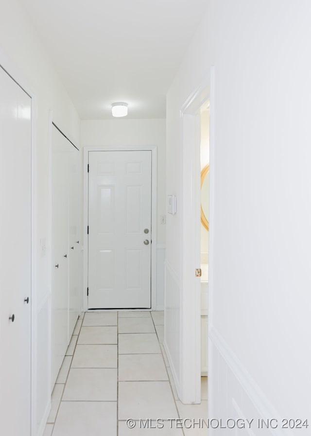 hallway with light tile patterned flooring