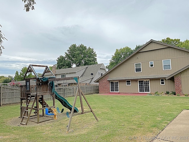 view of jungle gym with a lawn