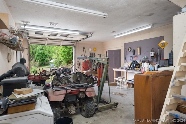 garage with a workshop area