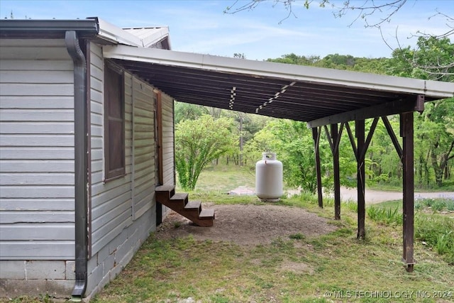 view of vehicle parking with a carport