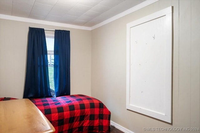 bedroom with ornamental molding