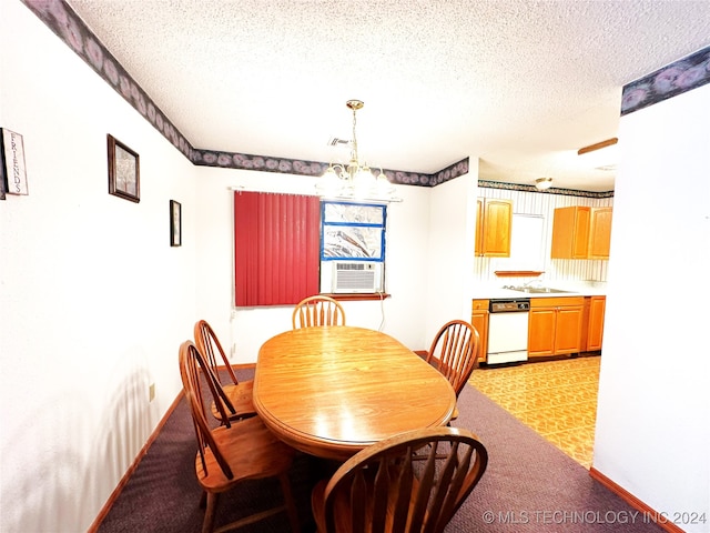 tiled dining area featuring cooling unit, sink, a textured ceiling, and an inviting chandelier