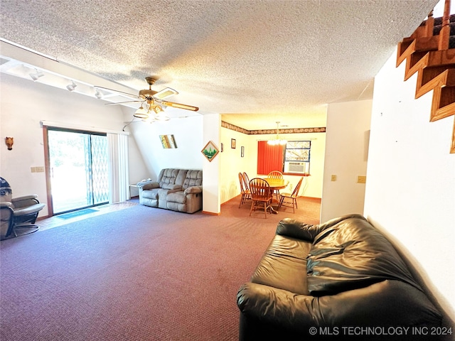 living room featuring ceiling fan, carpet flooring, a textured ceiling, and track lighting