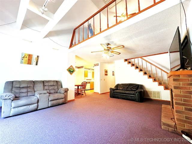 living room with ceiling fan, a textured ceiling, and carpet flooring