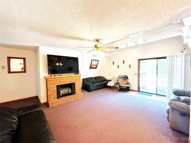 carpeted living room featuring ceiling fan, a textured ceiling, and a brick fireplace