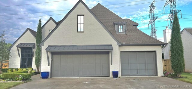 view of front of property with a garage