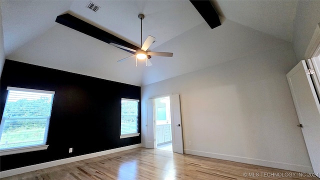 spare room featuring beam ceiling, ceiling fan, high vaulted ceiling, and light hardwood / wood-style floors