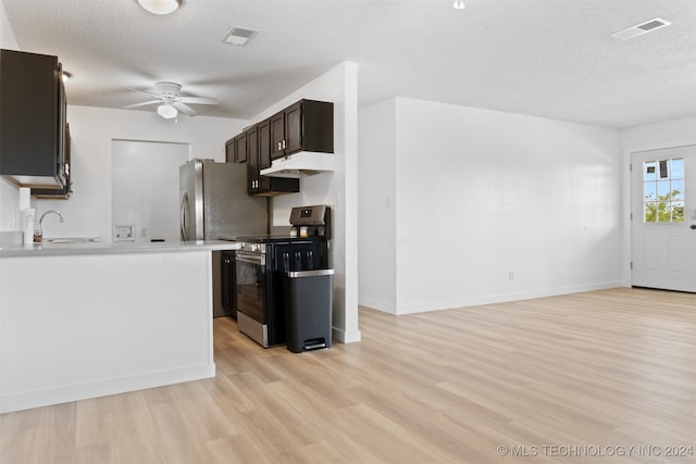 kitchen with range, extractor fan, light hardwood / wood-style floors, ceiling fan, and sink