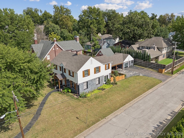 birds eye view of property with a residential view