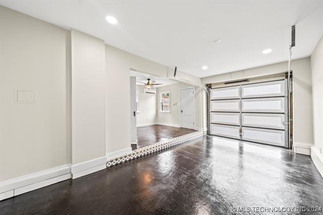 garage with baseboards and recessed lighting