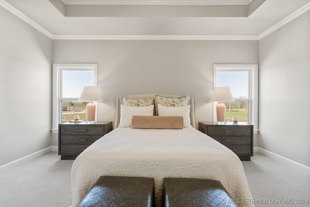 bedroom with carpet flooring, baseboards, and multiple windows