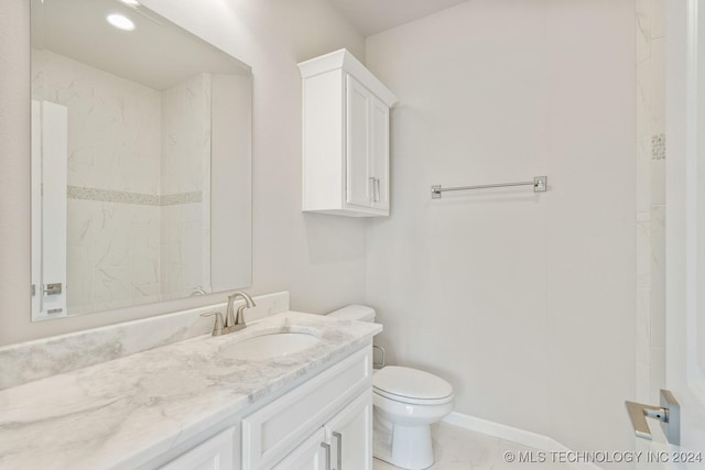 full bathroom featuring baseboards, vanity, marble finish floor, and toilet