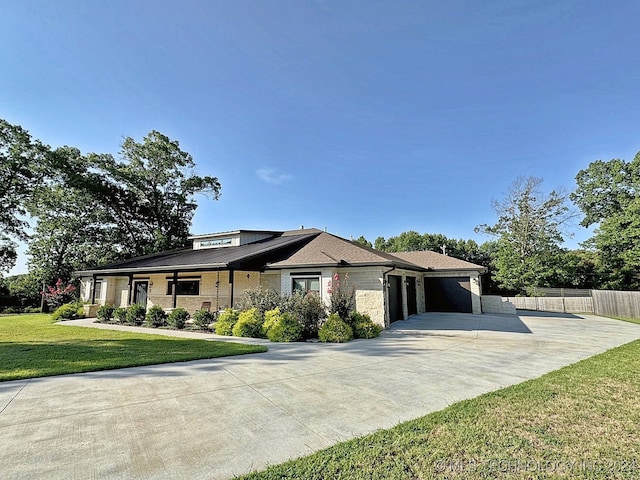 prairie-style house with a front lawn and a garage