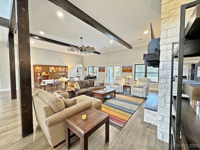 living room with beam ceiling, light hardwood / wood-style flooring, and ceiling fan