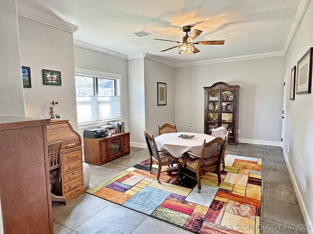 tiled dining space featuring ceiling fan and ornamental molding