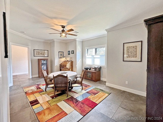 dining space featuring light tile patterned floors, crown molding, and ceiling fan