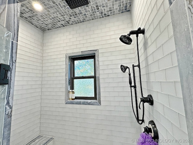 bathroom featuring tiled shower