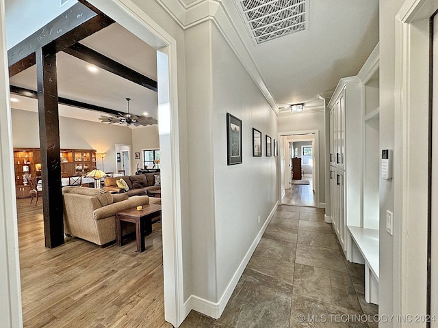 hall with beamed ceiling and hardwood / wood-style floors