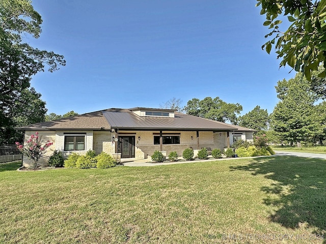 prairie-style house with a front lawn